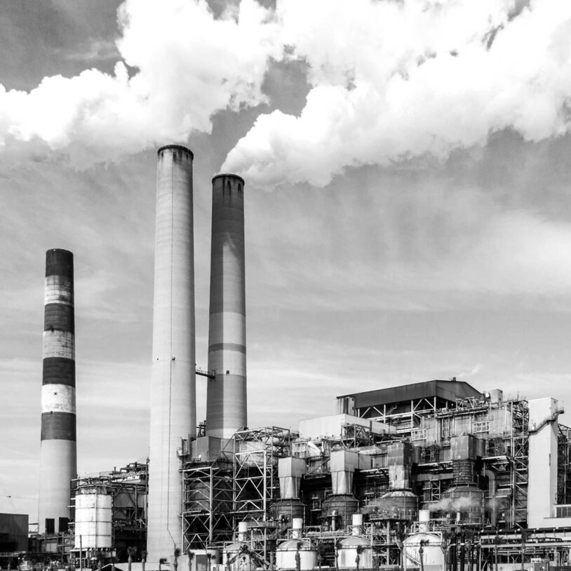 Image of smoke clouds leaving industrial chimneys to represent Hazardous areas and Industry.