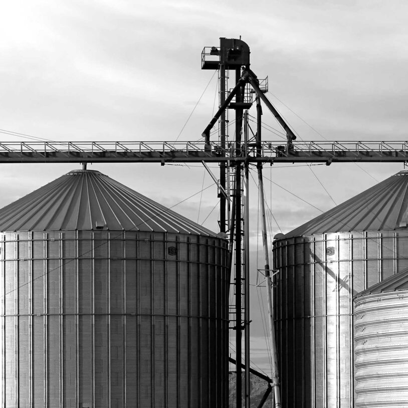 Image of large metal silos to represent silo and weighing industry