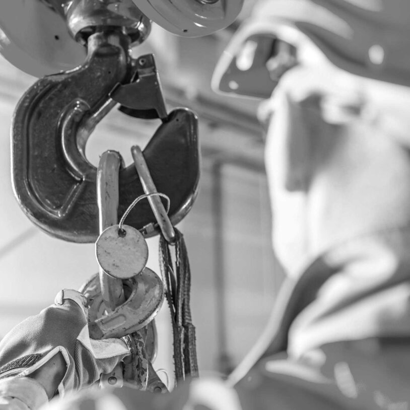 Man inspecting under hook weighing to represent Under Hook Weighing Industry and Industries.